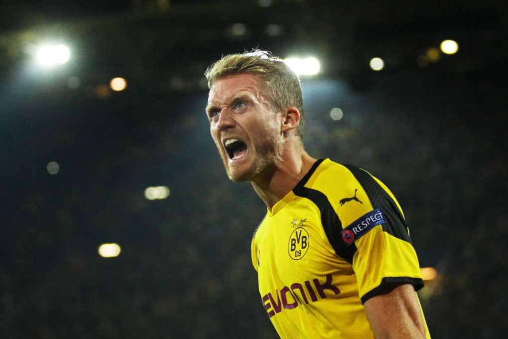 epaselect epa05559232 Dortmund's Andre Schuerrle celebrates after scoring the 2-2 equalizer during the UEFA Champions League group F soccer match between Borussia Dortmund and Real Madrid in Dortmund, Germany, 27 September 2016. EPA/INA FASSBENDER
