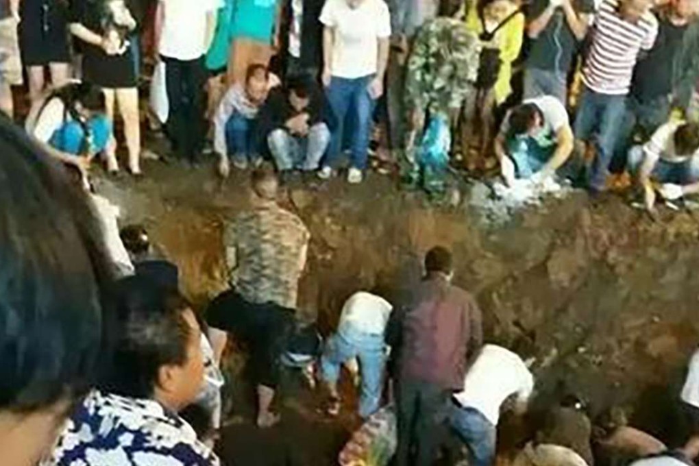 Locals flock to a construction site in hopes of finding jadeite. Photo: SCMP Pictures