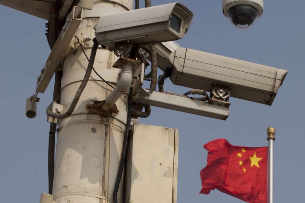 The Chinese national flag flies behind security cameras at Tiananmen Square. A new directive from the Ministry of Public Security proposes front-line police receive strengthened training on evidence gathering and use of equipment. Photo: AFP