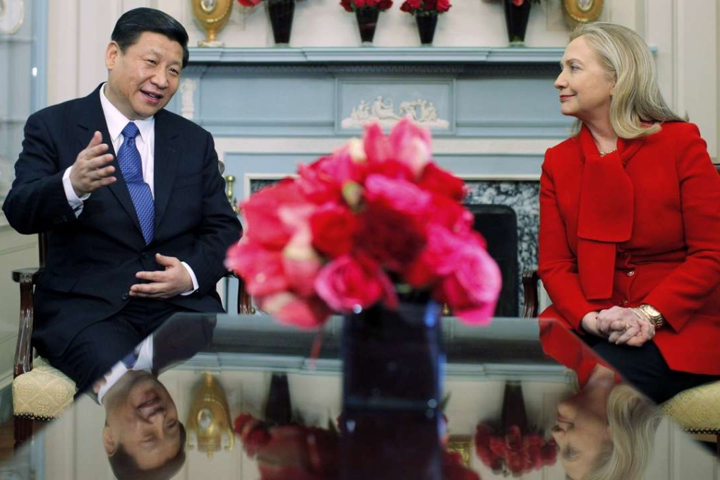 Then US secretary of state Hillary Clinton chats with then vice-president Xi Jinping at the State Department in Washington in February 2012. Photo: AP