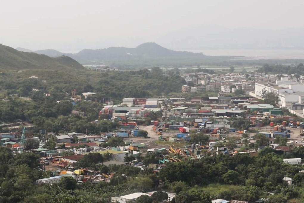 A brownfield site currently occupied by an open storage facility was part of the original development plan for Wang Chau in Yuen Long. Photo: Edward Wong