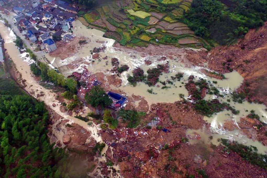 An aerial photo shows Chinese rescuers searching for survivors in the village of Sucun, in Zhejiang province, on Thursday morning following Wednesday’s landslide. Photo AFP