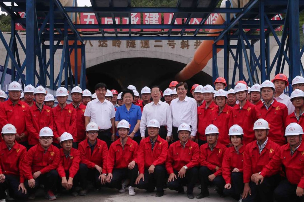 Vice-Premier Zhang Gaoli (in white, second right) visits workers at the construction site of the Badaling Great Wall Station of the Beijing-Zhangjiakou high-speed railway in Beijing. Photo: Xinhua