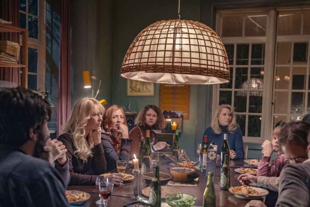 Trine Dyrholm (middle, dressed in blue) plays a co-founder of a commune in the film The Commune.