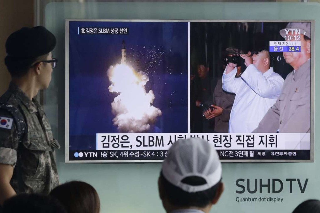 A South Korean army soldier watches a TV news program in August showing images published by North Korea of ballistic missile believed to have been launched from underwater. Photo: AP
