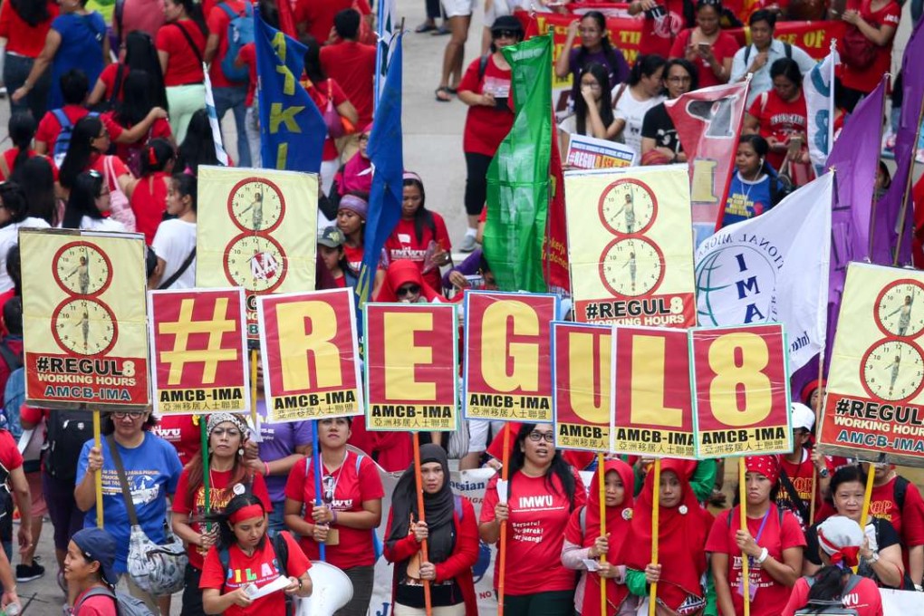 Domestic helpers march to call for a HK$790 pay rise. Photo: K. Y. Cheng