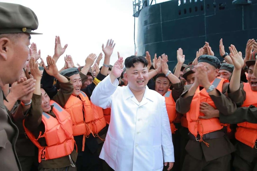 North Korean “supreme leader” Kim Jong-un inspects the test-firing of a strategic submarine-launched ballistic missile at an undisclosed location. Photo: AFP/ KCNA via KNS