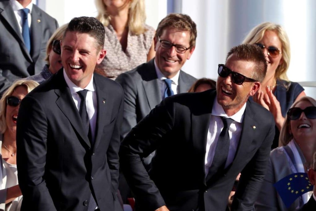 Justin Rose of England and Henrik Stenson of Sweden laugh during the Opening Ceremony for the 41st Ryder Cup. They have been paired together as Europe’s strongest two. Photo: USA Today