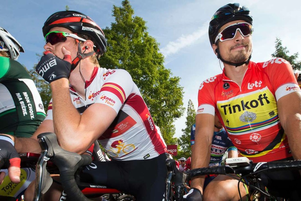 Australian cyclist Rohan Dennis of BMC Racing Team, wearing the jersey of the leader, and Slovakian cyclist Peter Sagan of Tinkoff, wearing the red jersey, wait before the start of the fourth stage of the Eneco Tour cycling race, a 202 km race from Aalter to Sint-Pieters-Leeuw, Belgium, on September 22, 2016. Photo: AFP