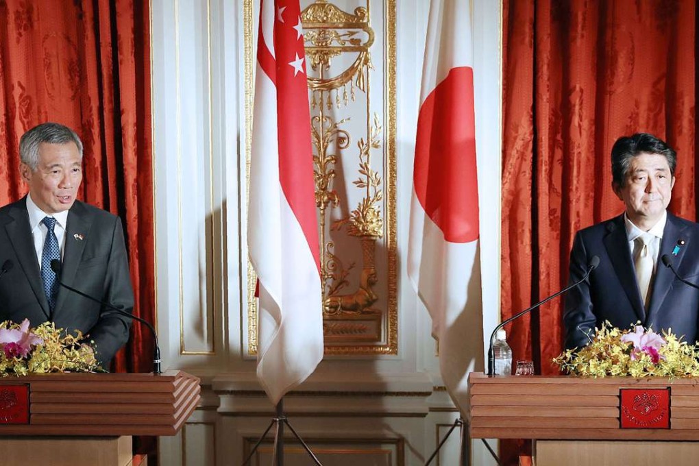 Prime Minister Shinzo Abe, right, and his Singaporean counterpart Lee Hsien Loong attend a joint press conference following their talks in Tokyo on Wednesday. Photo: Kyodo