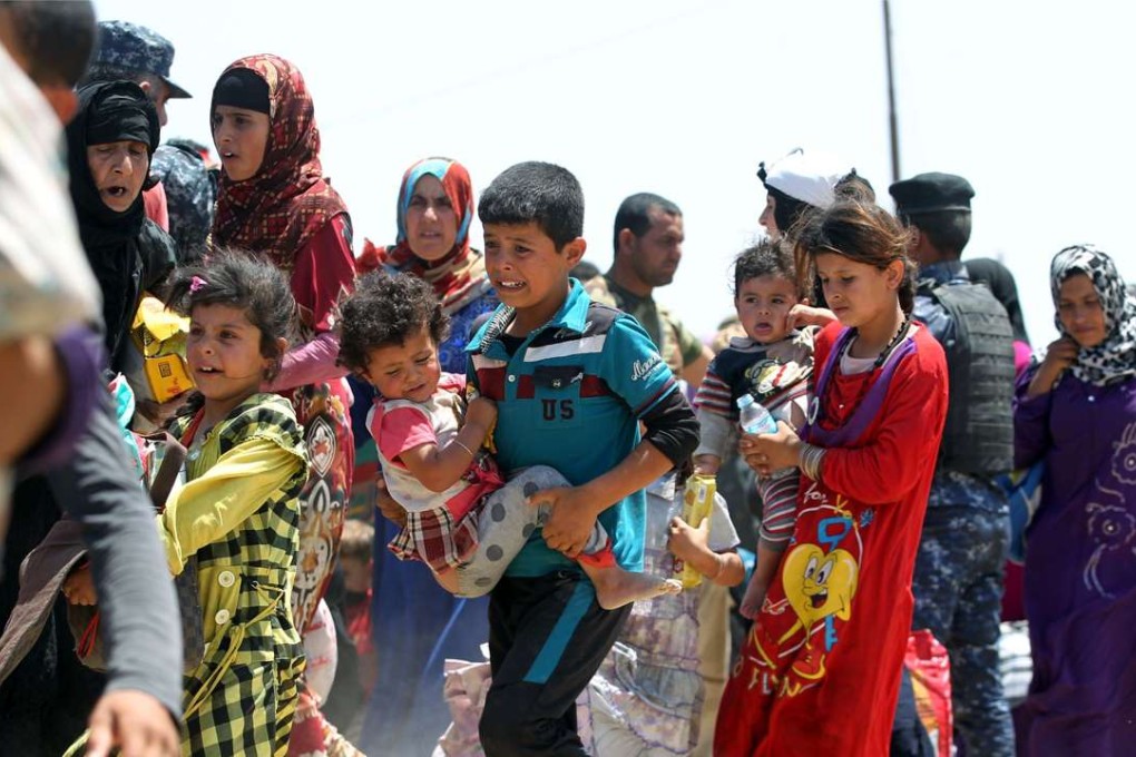 Iraqi families flee the city of Fallujah in May. Photo: AFP