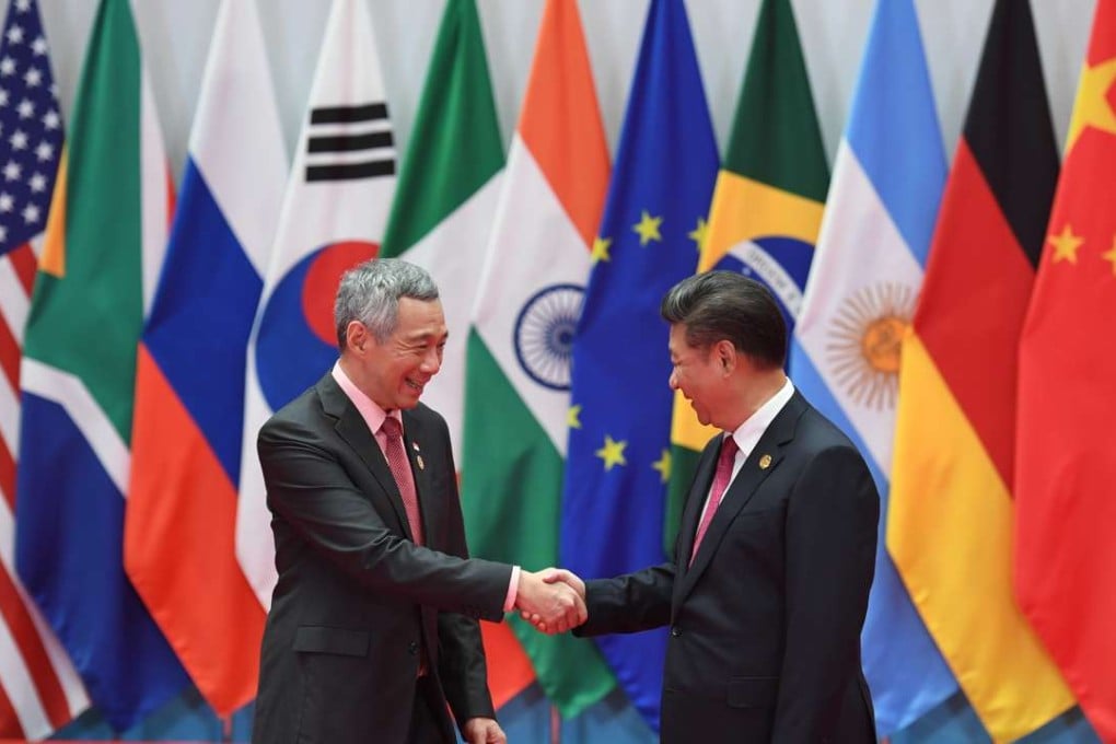 Singapore’s Prime Minister Lee Hsien Loong shakes hands with China’s President Xi Jinping at the G20 summit in Hangzhou. Photo: AFP