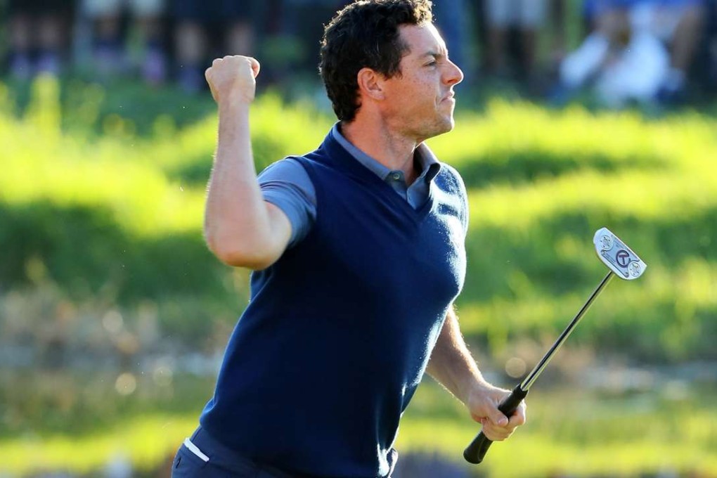 Rory McIlroy of Europe reacts on the 16th green after making a putt to win the match during afternoon fourball matches. AFP