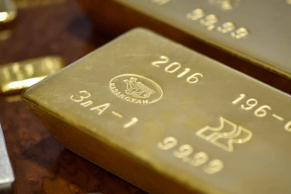 Gold bars imprinted with the word Kazakhstan seen in the country's National Bank vault, Photo: Reuters