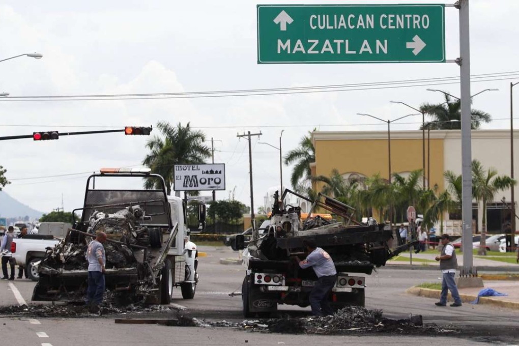 The ambush was allegedly organised to rescue a high ranking cartel member who was being transported to a hospital. Photo: EPA