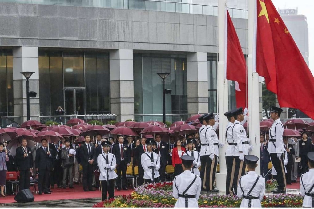 The flag-raising ceremony to mark the 67th National Day. Photo: Jonathan Wong