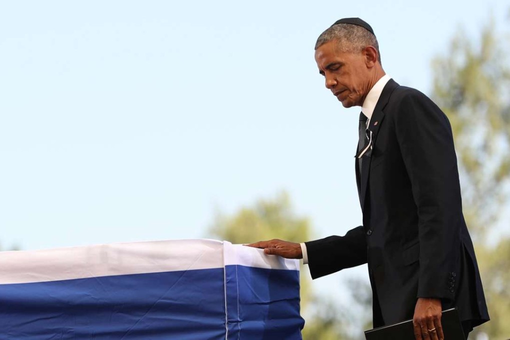 US President Barack Obama pays his respects to Israel's former president Shimon Peres during his funeral on Friday, September 30, 2016 at Mount Herzl cemetery in Jerusalem. Photo: Xinhua/TNS
