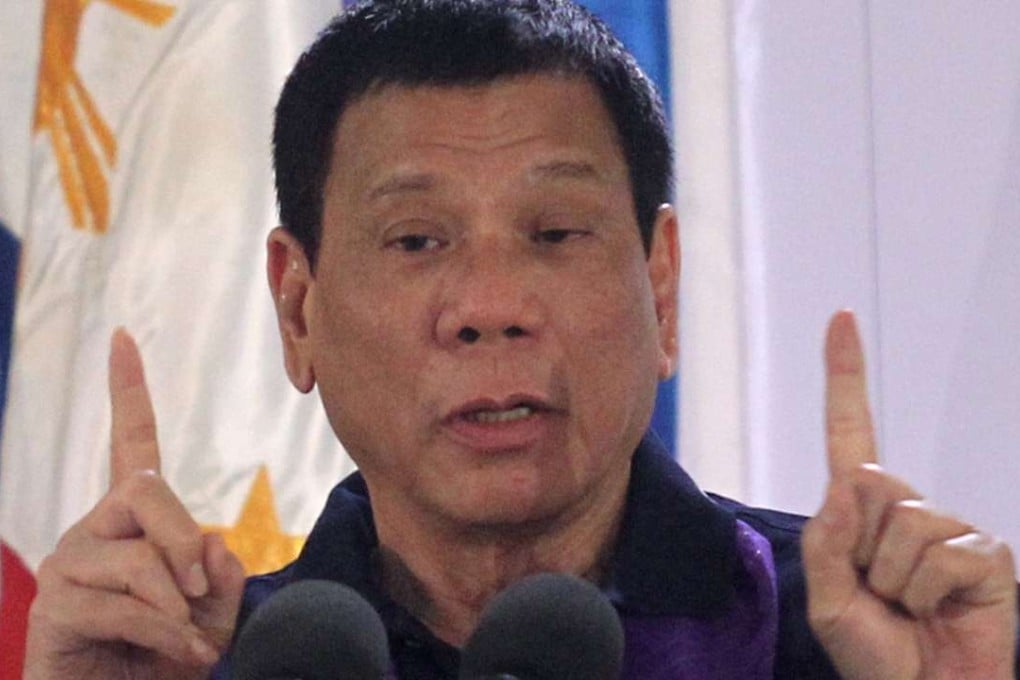 Philippines President Rodrigo Duterte gestures while delivering a speech before female police officers during a gathering in Davao city, Philippines September 30, 2016. Picture taken September 30, 2016. REUTERS/Lean Daval Jr