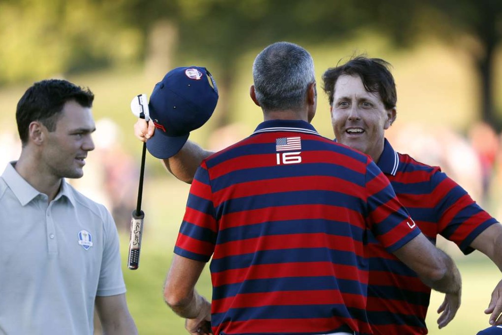 Phil Mickelson celebrates his putt at 17 as the US take a grip on the 2016 Ryder Cup. Photo: TNS