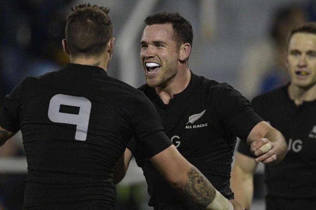 New Zealand centre Ryan Crotty celebrates with team-mate TJ Perenara. Photos: AFP