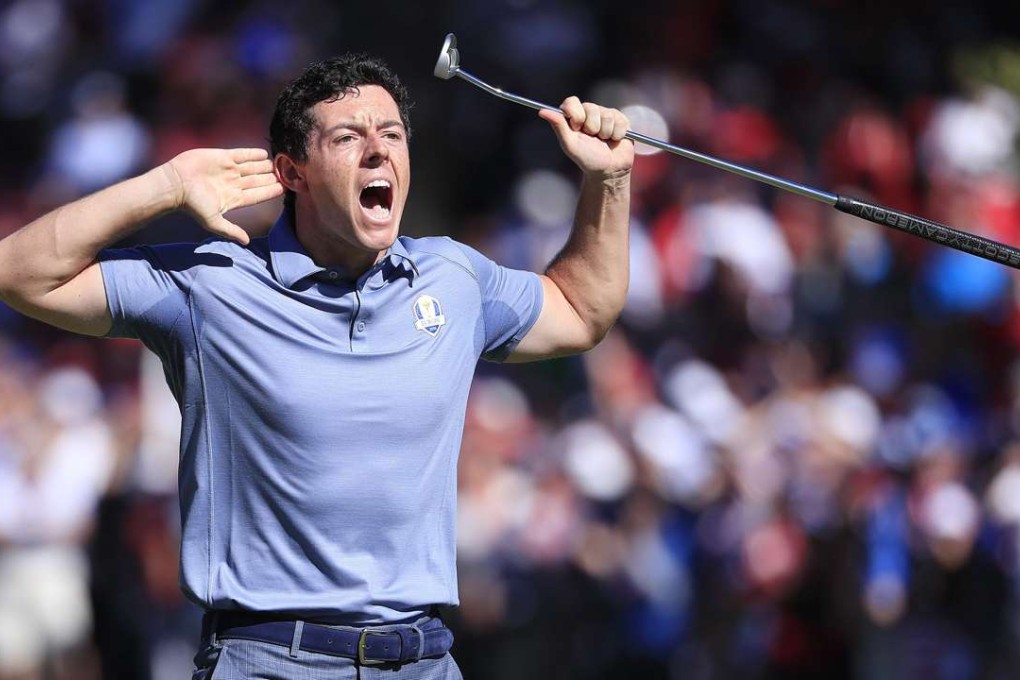 Rory McIlroy reacts to the gallery after his putt on the eighth hole during his singles match with Patrick Reed. Photo: EPA