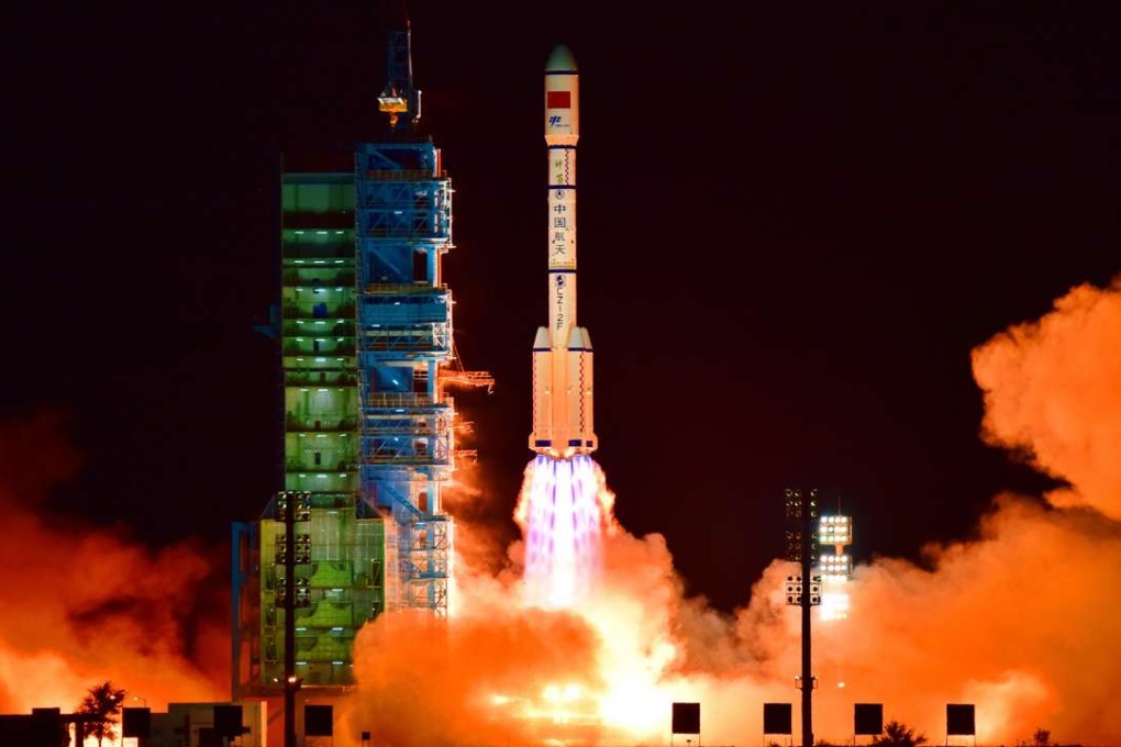 China’s Tiangong-2 space lab is launched on a Long March-2F rocket from the Jiuquan Satellite Launch Centre in the Gobi Desert on September 15. The lab is equipped with 14 space instruments including a cold atomic clock, developed by researchers in Shanghai. Photo: AFP