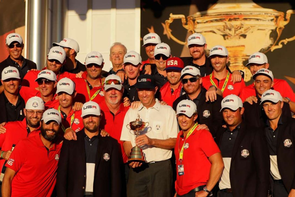 Captain Davis Love III of the United States celebrates with his team and their caddies during the closing ceremony of the 2016 Ryder Cup at Hazeltine. Photo: AFP