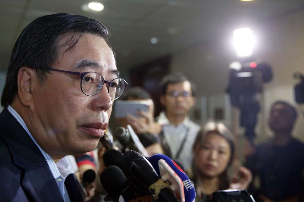Andrew Leung Kwan-yuen speaks to the press after attending a meeting of pro-establishment lawmakers. Photo: Sam Tsang