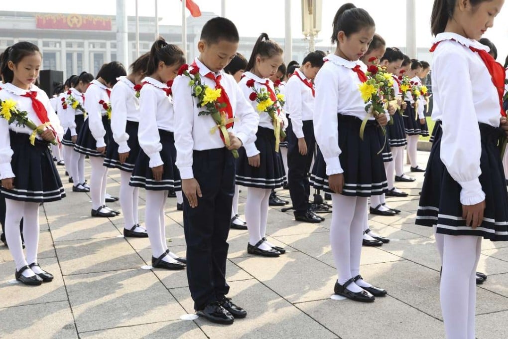 A ceremony is held to present flowers to the people’s heroes at Beijing’s Tiananmen Square on Martyrs’ Day this year. China’s legislature named September 30 as Martyrs’ Day in 2014, to commemorate those who died fighting for national causes. Photo: Xinhua