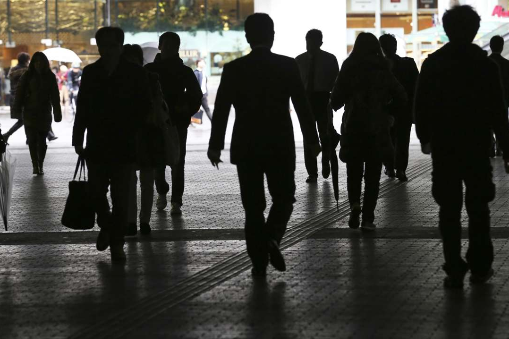 People walk on a street in Tokyo. Photo: AP/Koji Sasahara