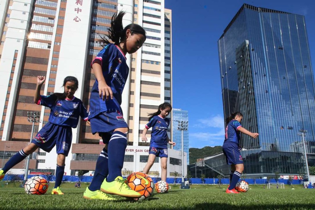 Children play football at the Jockey Club Kitchee Centre in Shek Mun. Photo: David Wong