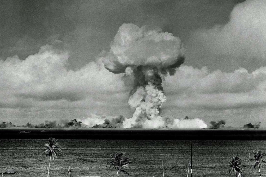 The mushroom cloud of an atom bomb rises among abandoned ships in Bikini lagoon, Marshall Islands in 1946. Photo: AP