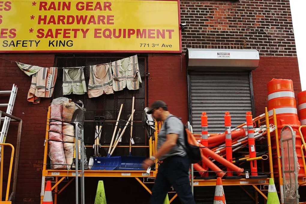 Worker's safety equipment is sold on the sidewalk in the Sunset Park neighbourhood of Brooklyn. Photo: AFP