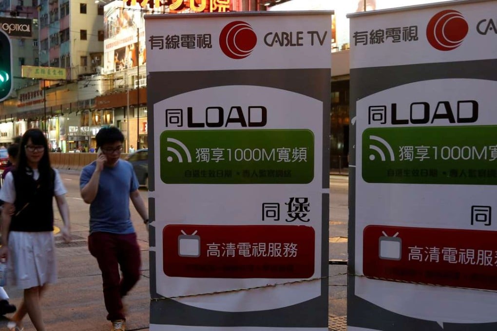 Banners advertising Wharf Holdings' i-Cable internet business are displayed on a street in Hong Kong. Photo: Reuters