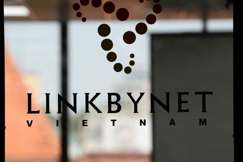 The logo of French IT company Linkbynet at their offices in Ho Chi Minh City. A decade ago app technology would likely have been developed in California's Silicon Valley, but today those apps are being churned out by Vietnam's startup sector -- an industry driven by local techies trained overseas but returning home to prowl for opportunities. Photo: AFPi
