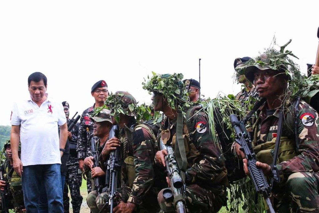 Phillippines President Rodrigo Duterte visits the Philippine Army Scout Rangers at their headquarters in the town of San Miguel, Philippines. Duterte would face major obstacles to following through on his threat to reduce purchases of US weapons in favour of Russian and Chinese arms. Photo: EPA