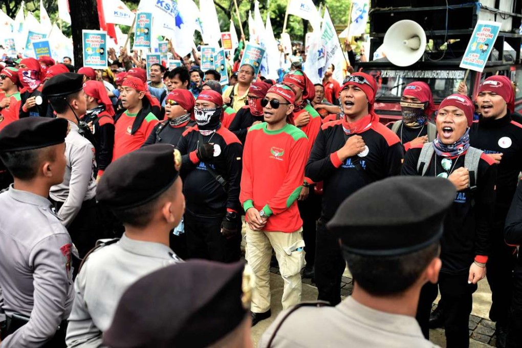Workers rally in Jakarta to demand the cancellation of tax amnesty. Photo: AFP