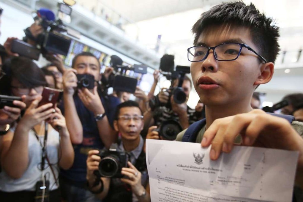 Joshua Wong speaks at Hong Kong International Airport after arriving back from Bangkok on Wednesday. Photo: Sam Tsang
