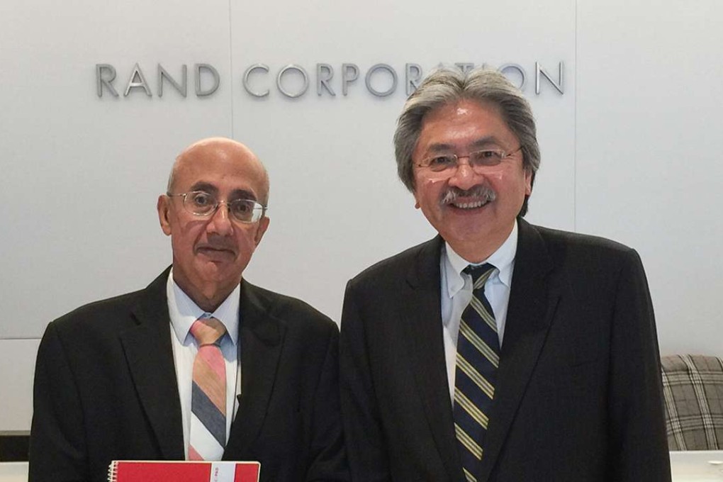 John Tsang with Rafiq Dossani (left), director of the RAND Centre for Asia Pacific Policy, during a visit to the RAND Corporation, a think-tank in the US. Photo: SCMP Pictures