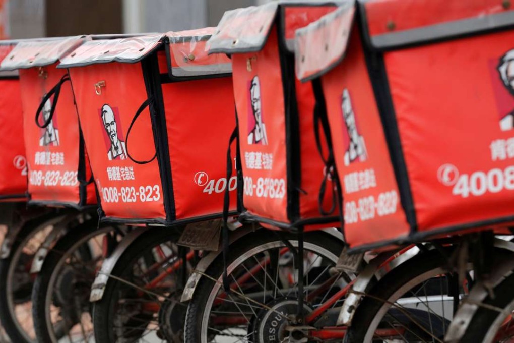 Logos of KFC, owned by Yum Brands Inc, adorn delivery bicycles in front of its restaurant in Beijing, China. Photo: Reuters