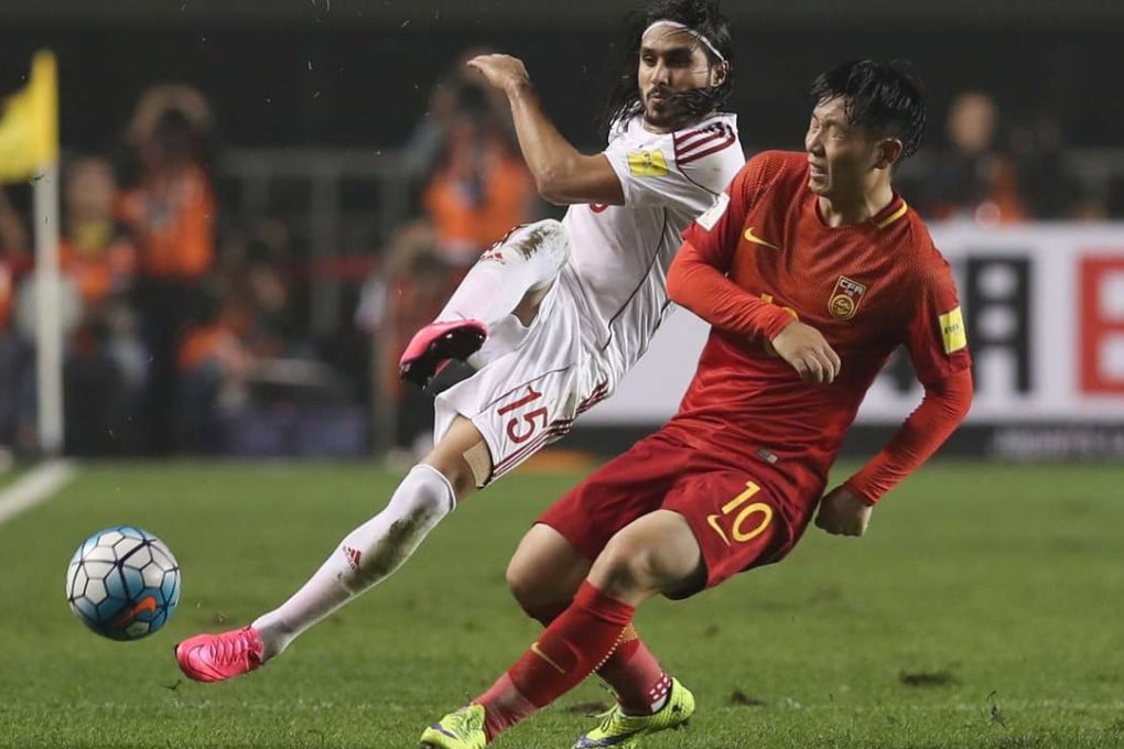 Alaa al-Shebli of Syria and Zhang Xizhe of China in action. Photo: Reuters
