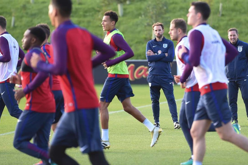England caretaker manager Gareth Southgate watches his players during a training session. Photo: AFP