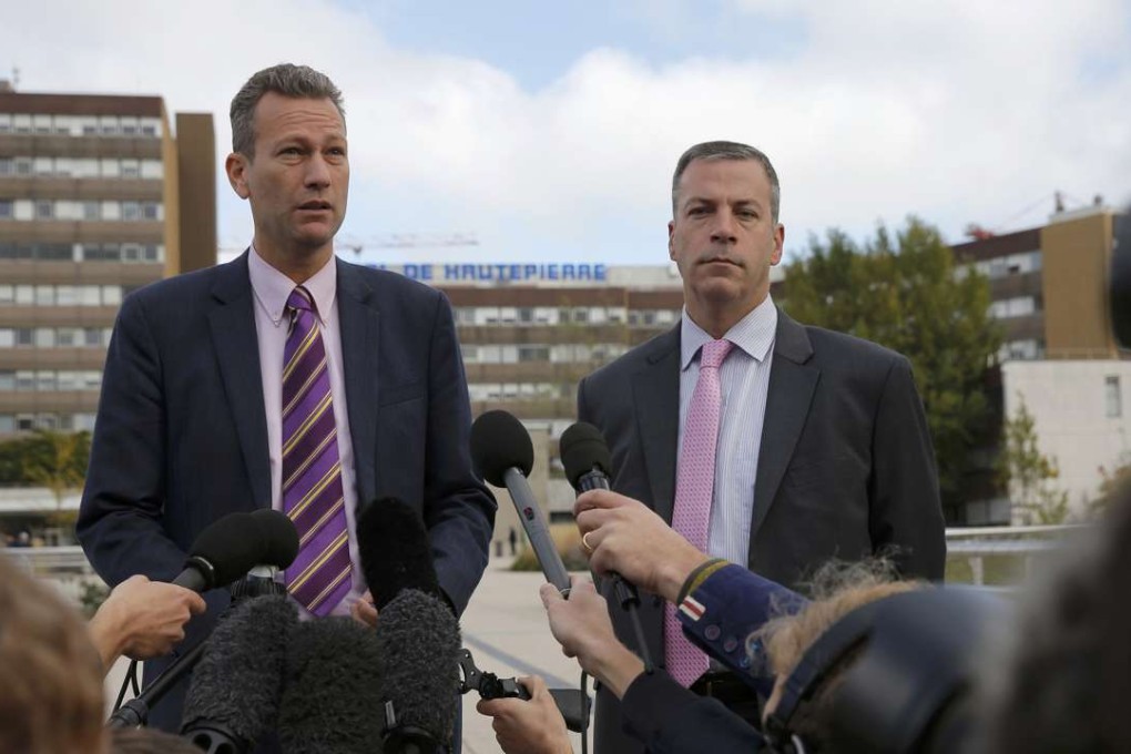 Member of the European Parliamen Nathan Gill and UKIP press officer Hermann Kelly talk to journalists outside the Hautepierre Hospital in Strasbourg, France. Photo: Reuters