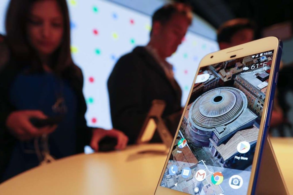 Guests inspect the new Pixel phone by Google after it was introduced at a Google product event in San Francisco. Photo: EPA