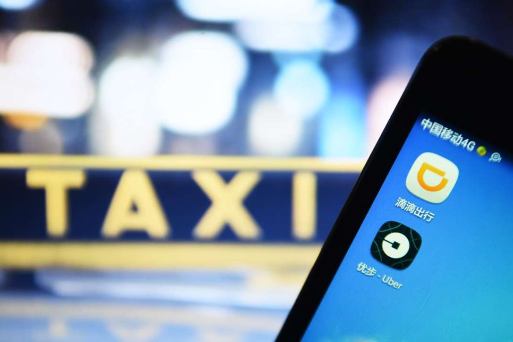 The apps of Didi and Uber appear on a mobile phone. Photo: Xinhua