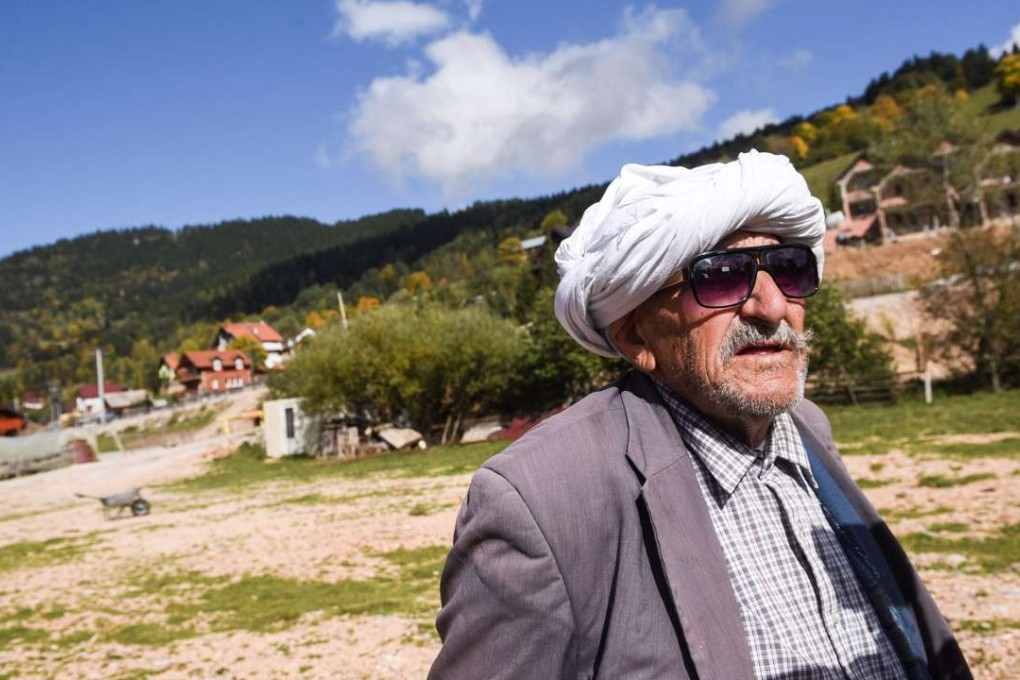Arif Demaj with a traditional Rugova white head-kerchief in the village of Boge in western Kosovo. Photo: AFP