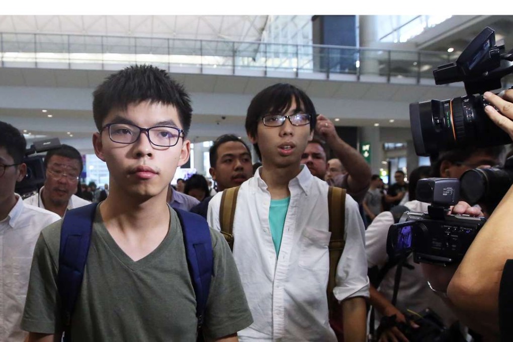 Joshua Wong (centre) arriving back at Hong Kong International Airport after being detained by Thai authorities and denied entry to Thailand. Photo: Sam Tsang