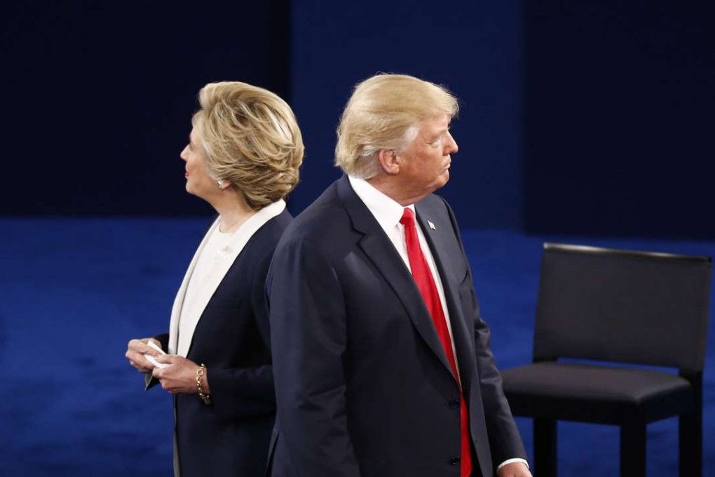 Republican Donald Trump and Democrat Hillary Clinton during the second presidential debate at Washington University in Missouri. Photo: Bloomberg