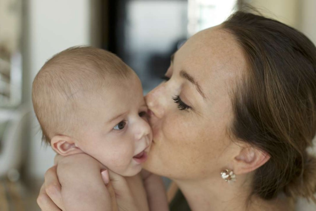 Amelie Dionne-Charest, organiser of the Hong Kong Maternity Conference, with her child.