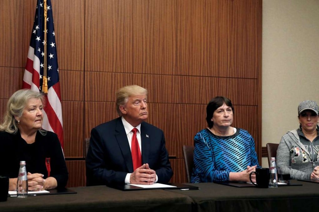 Republican presidential nominee Donald Trump sits with (from left) Juanita Broaddrick, Kathy Shelton and Paula Jones in St Louis, Missouri. The women have all accused Bill Clinton of various sexual misdeeds. Photo: Reuters
